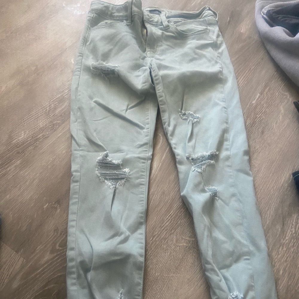 Light bluish green AE skinny jeans